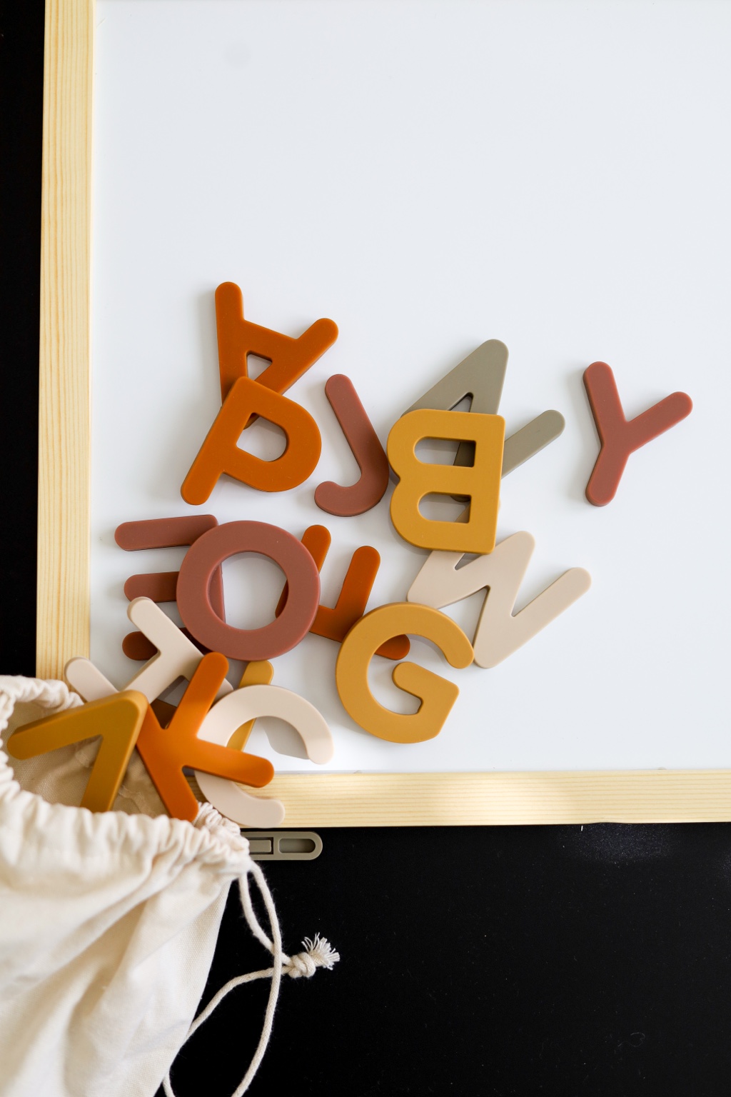 Magnetic alphabet letters styled on a board